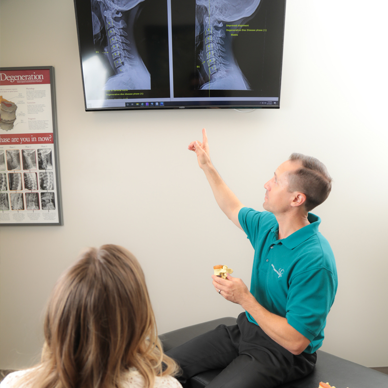 Chandler Chiropractic in Chandler and Scottsdale reviewing x-ray with patient.